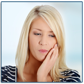 woman grabbing her jaw in pain